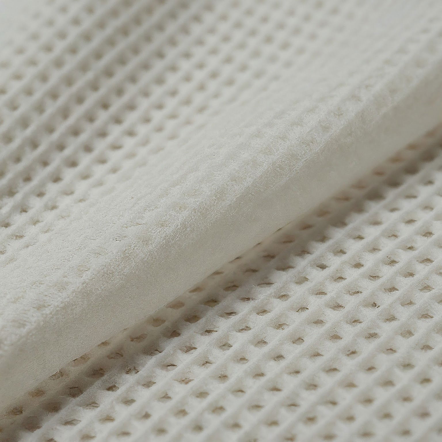 Perforated non woven fabric
